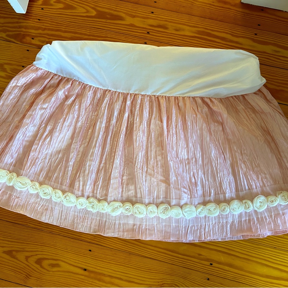 Custom made crib skirt, pink with ivory appliqués